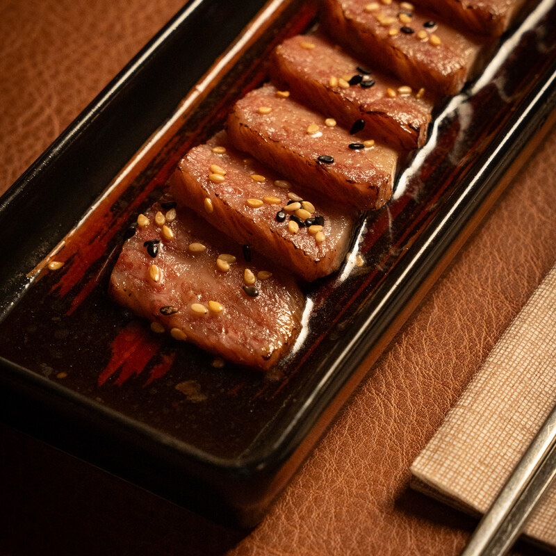 Seared and sliced Wagyu tataki with toasted sesame